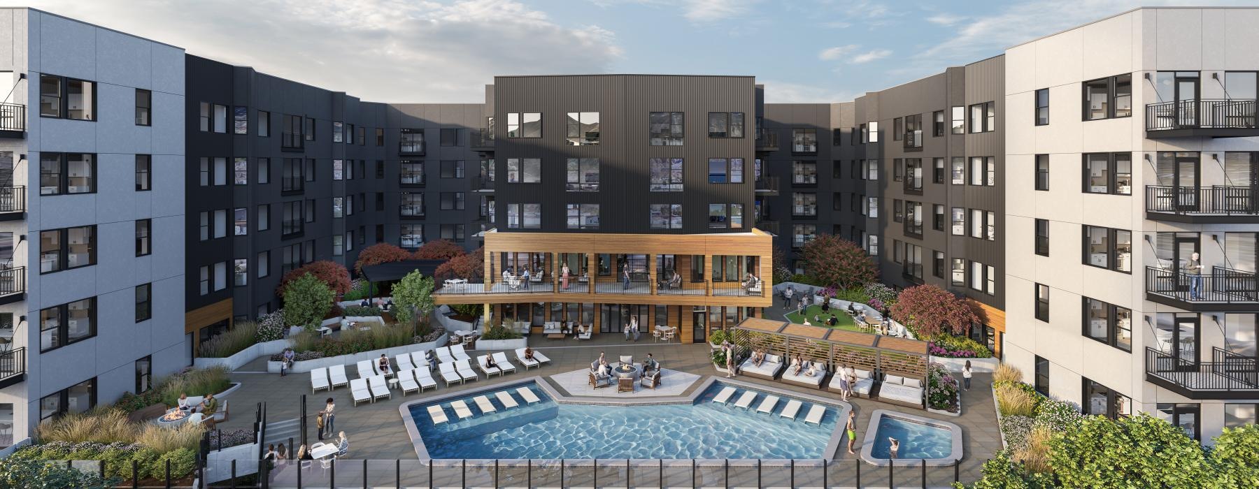 a large building with a pool in front of it