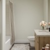 a bathroom with a tub and toilet